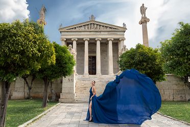 Model doing a flying dress photoshoot at the National University of Athens
