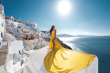 Flying dress shoot with caldera view in Oia