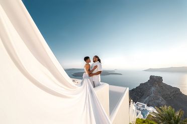 White flying dress photoshoot of a beautiful couple